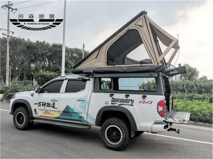 Pickup fitted with a TUYU high-cover canopy camper with the tent raised at camp