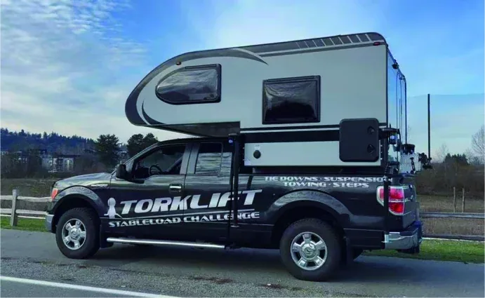 Customer photo of a TUYU FRP hard-top camper with overcab profile