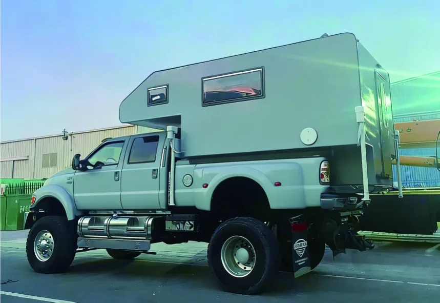 Large TUYU T5 residence camper bolted to a heavy-duty pickup chassis